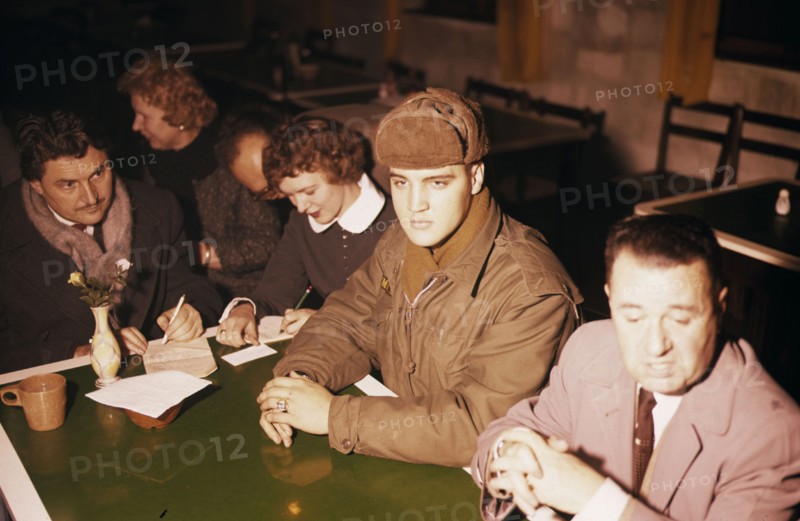 Elvis PRESLEY as a soldier during a press conference, 1958