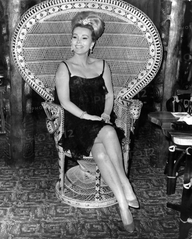Zsa Zsa GABOR in the wicker chair at a press conference in 1964