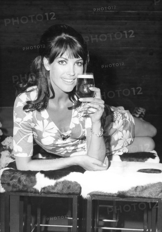 Petra SCHÜRMANN poses with a glass of beer