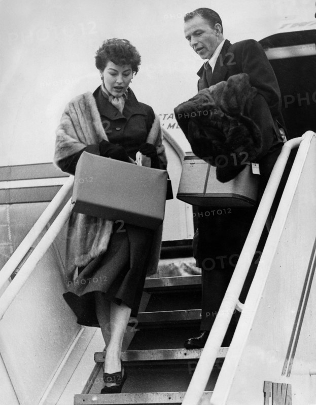 Frank SINATRA with wife Ava GARDNER at London airport, 1952
