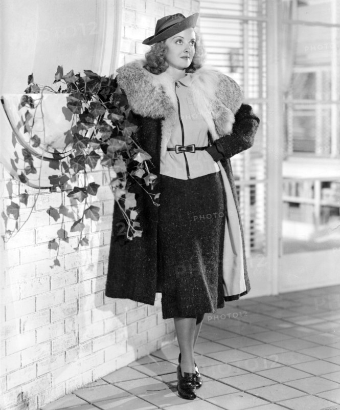Bette DAVIS poses in a costume, 1937