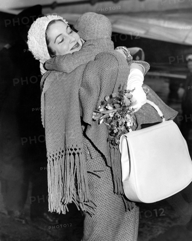 Valerie HOBSON hugs her son David John PROFUMO, London 1961