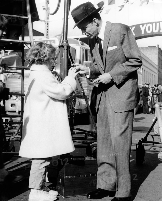 Frank SINATRA gives an autograph