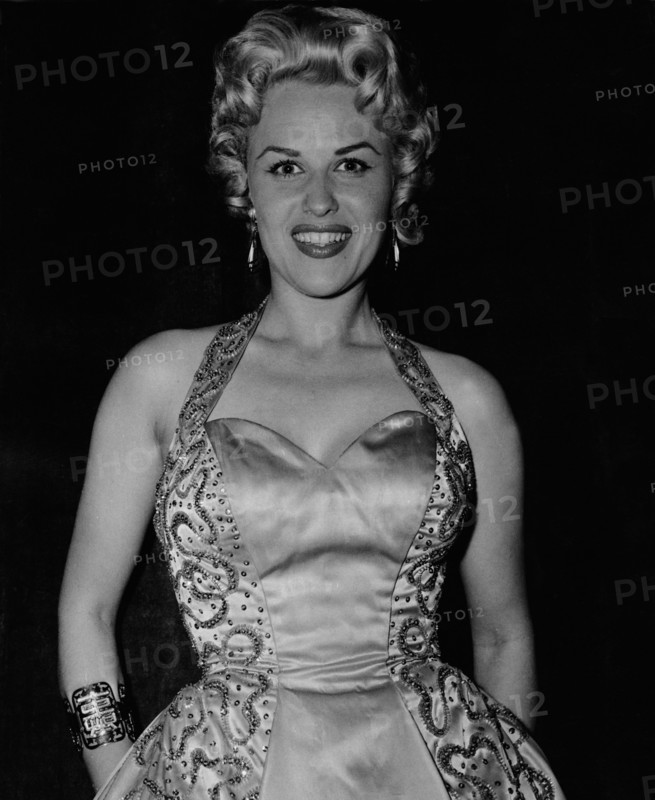 Bibi JOHNS in an evening dress for a celebratory occasion