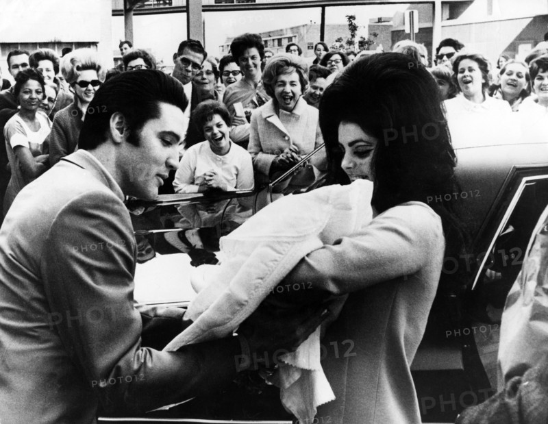Elvis PRESLEY with his wife and daughter leaving the Baptist Hospital, 1968