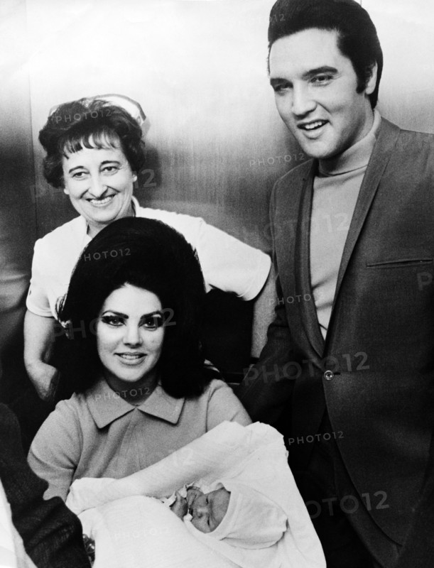 Elvis PRESLEY with his wife and daughter leaving the Baptist Hospital, 1968
