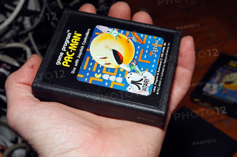 Hand and PacMan Pac-man console game cartridge for Atari.