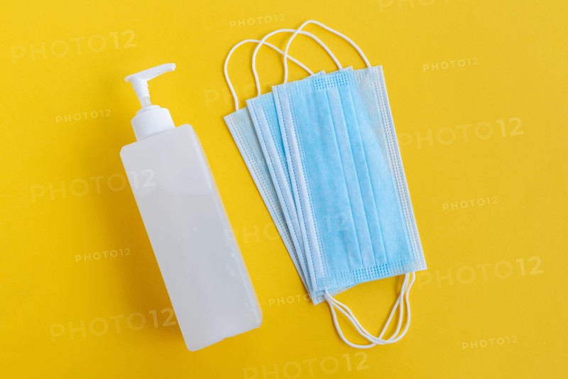 Hand Sanitizer and 3 layer surgical mask - Corona Virus Covid 19 concept - Health and care.