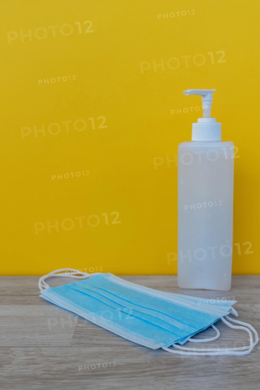 Hand Sanitizer and 3 layer surgical mask - Corona Virus Covid 19 concept - Health and care.