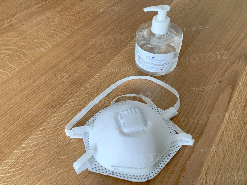 covid or coronavirus prevention kit with ffp2 mask and hand sanitizer gel bottle