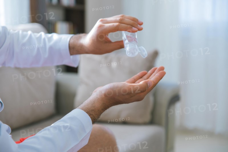 Cleaning and disinfection of hands with hand sanitizer gel for Stopping the spread of Covid-19, 2019-nCoV or Coronavirus. Disinfecting hands to clean