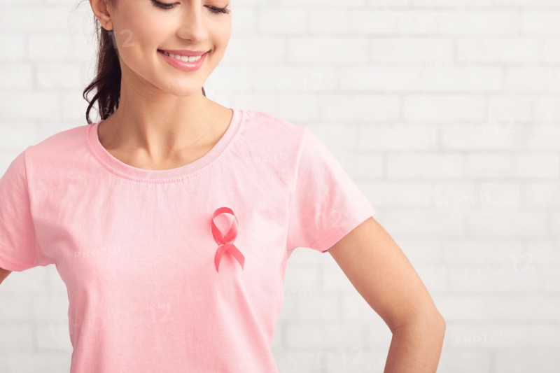 Girl Posing In T-Shirt With Cancer Ribbon On White Background