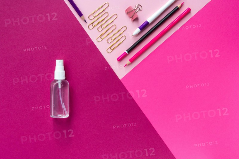 Top view of school stationery and sanitizer and on a multicolored background. Back to school 2020 flat lay and Copy space