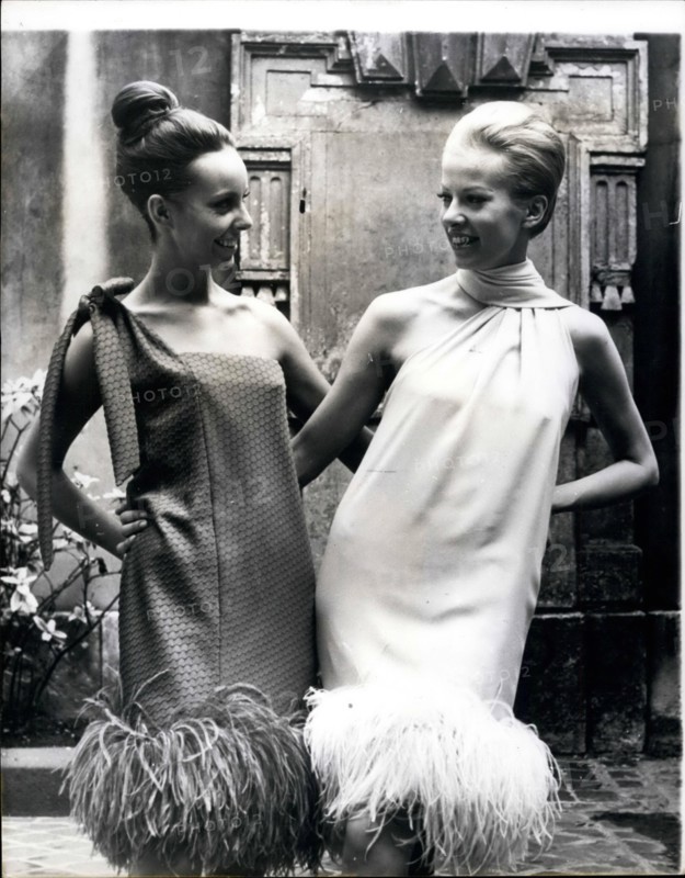 Aug. 08, 1965 - Fashions from the Cardin Collection. Photo shows among the latest fashions from Paris are these two typical dresses from Pierre Cardin's Autumn and Winter Collection. Both are trimmed at the bottom with ostrich feathers.
