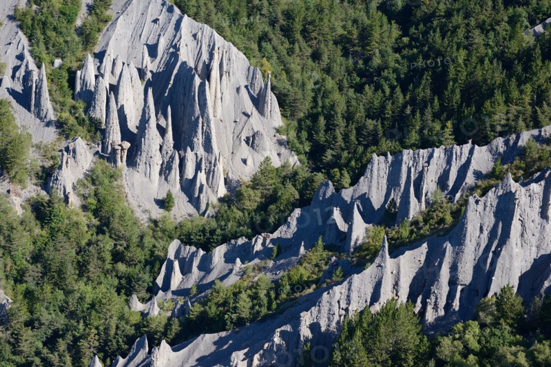 HOODOOS IN A FOREST (aerial view). Théus, Hautes-Alpes, France.