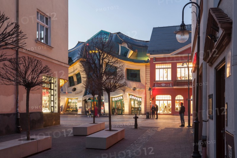 Evening at Krzywy Domek (Crooked House) in Sopot, Poland.