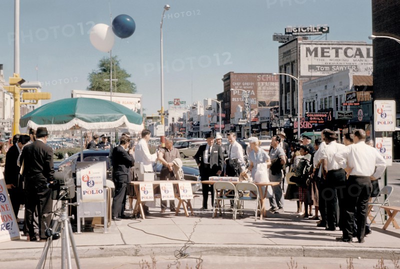 People in Columbus, Georgia awaiting polio vaccination during the earlier days of the National Polio Immunization Program, 1973. In the early 1950's, there were more than 20, 000 cases of polio each year. After polio vaccination began in 1955, cases dropped significantly. By 1960, the number of cases dropped to about 3, 000, and by 1979 there were only about 10. Image courtesy CDC/Charles N. Farmer.