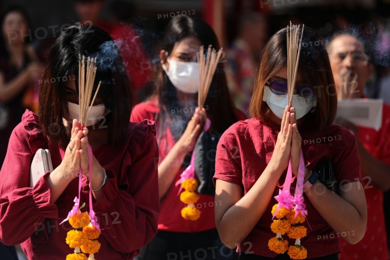 Women pray while wearing dust masks during the celebration at Leng Noei Yi Temple in Chinatown, Bangkok.The Lunar New Year, also known as Spring Festival in China marks the beginning of the Year of the Rat. The ethnic Chinese-Thai family pray for good fortune and wear masks for dust protection as the country struggles to contain worsening air pollution.
