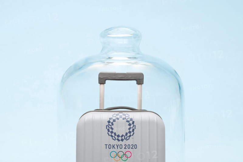 Belgrade, Serbia - 19th April 2020": suitcase with Tokyo 2020 Olympic rings in quarantine, coronavirus and travel restrictions concept.