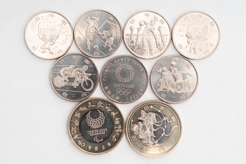 Tokyo, Japan - January 4, 2021: Commemorative coins of 100 yen and 500 yen for the Tokyo 2020 Olympic Games.