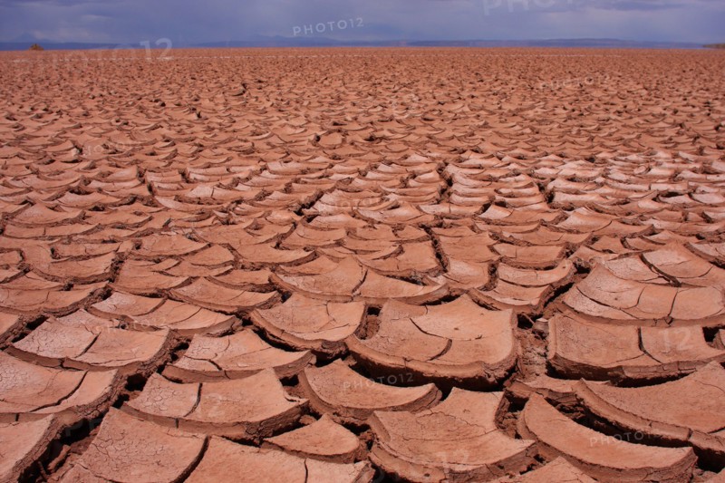 A huge expanse of cracked, dry, mud and soil on Bolivia's Altiplano.