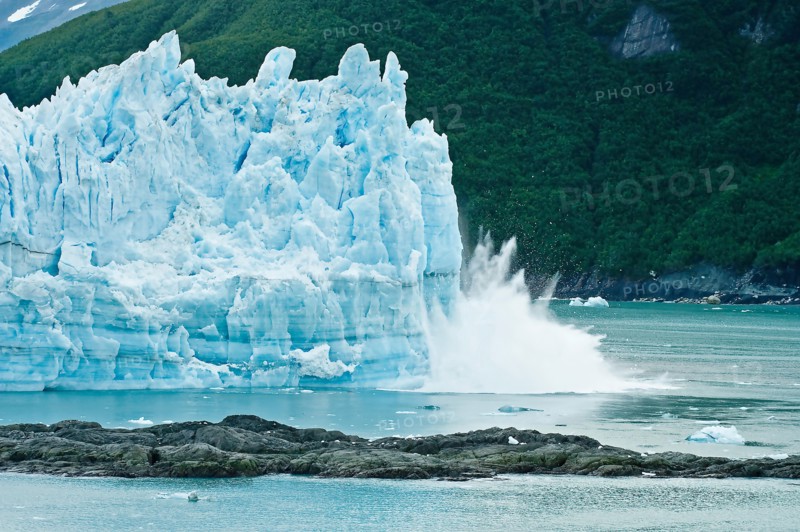 Alaska cruise - calving glacier -  Hubbard glacier -  a huge iceberg calves into Disenchantment Bay - St. Elias Alaska. - near Yukon, Canada.
