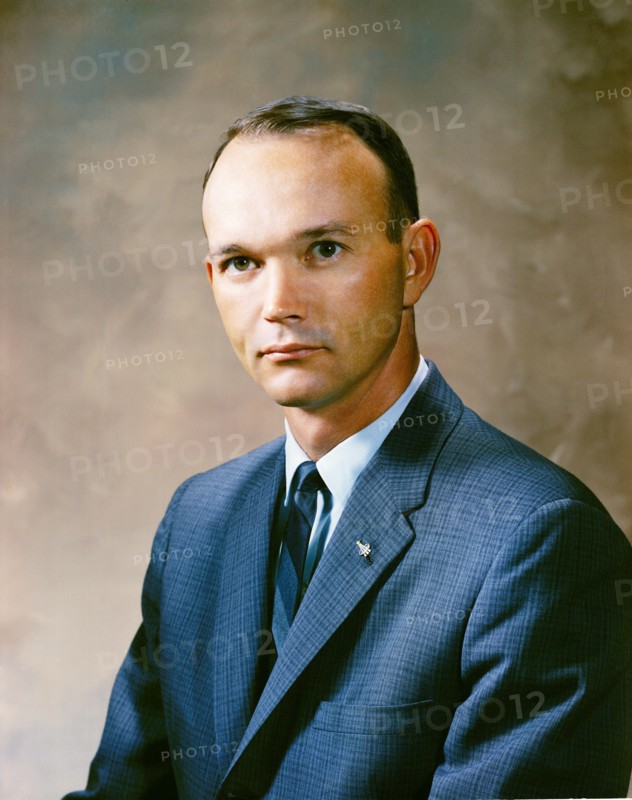 Portrait of astronaut Michael Collins in a business suit.