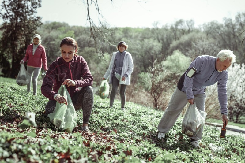 Volunteers cleaning up forest after inferior people