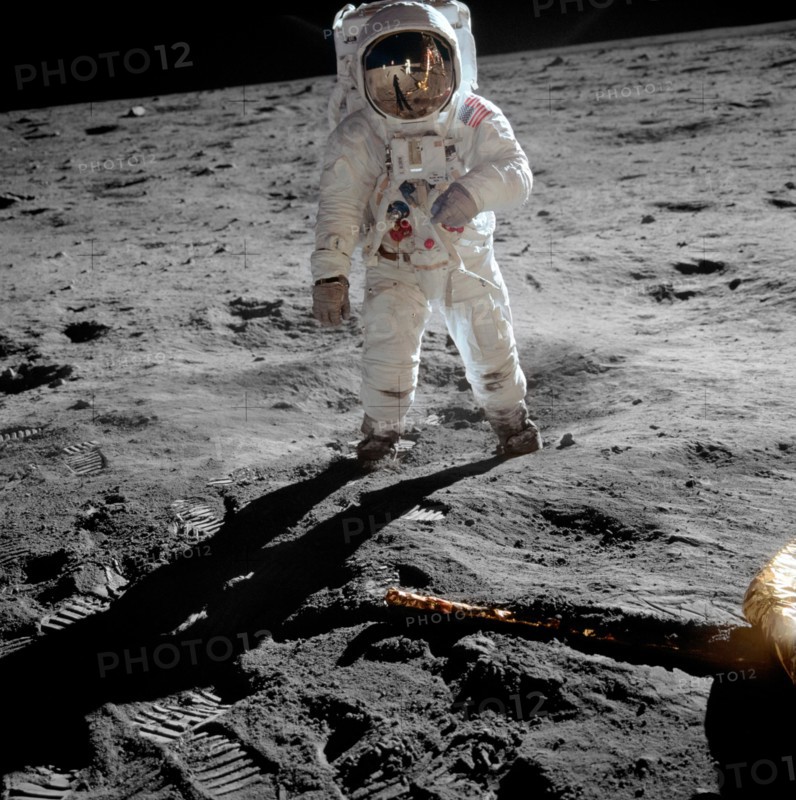 Astronaut Buzz Aldrin on the moon - Astronaut Buzz Aldrin, lunar module pilot, stands on the surface of the moon near the leg of the lunar module, Eagle, during the Apollo 11 moonwalk. Astronaut Neil Armstrong, mission commander, took this photograph with a 70mm lunar surface camera. While Armstrong and Aldrin descended in the lunar module to explore the Sea of Tranquility, astronaut Michael Collins, command module pilot, remained in lunar orbit with the Command and Service Module, Columbia. July 1969