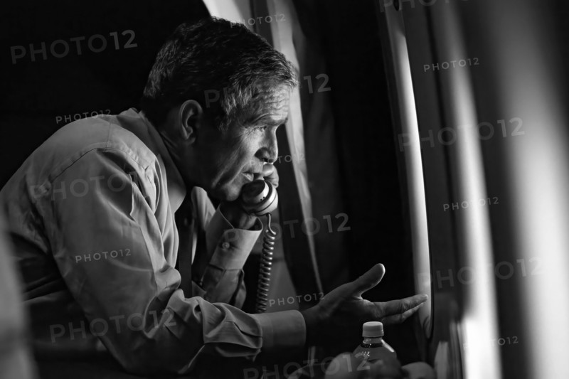 President George W. Bush talks on the phone with Vice President Dick Cheney from Air Force One after departing Offutt Air Force Base in Nebraska for Washington, D.C. on Tuesday, September 11, 2001.