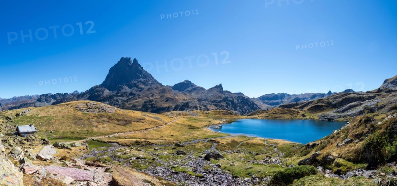 Pic du Midi d'Ossau mountain and Lac Gentau mountain lake in Ossau Valley, iconic symbol of the French Pyrenees, protected area of Pyrenees National P