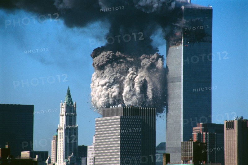 WTC (world trade center) 2 collapsing as WTC 1 still stands behind it in NYC on September 11th, 2001.