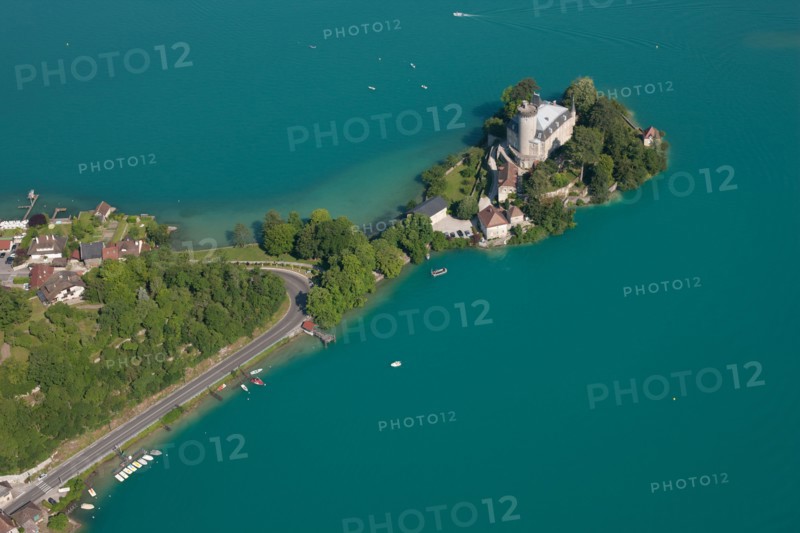 DUINGT CASTLE (aerial view). Medieval castle on a peninsula in the turquoise waters of Lake Annecy. Haute-Savoie, France.