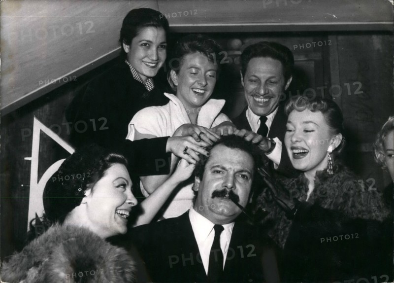 Mar. 03, 1954 - Have a Shampoo?: Georges Brassens, famous 'Realistic' singer being given ''Shampoo'' by three charming singers (from left to right) Arlette Sauvage, Leila Farida, Dick Micheyl, Jean Sablon (The crooner) and Dominious Wills. Picture taken in a Paris music hall where Dick Micheyl presented six new songs.