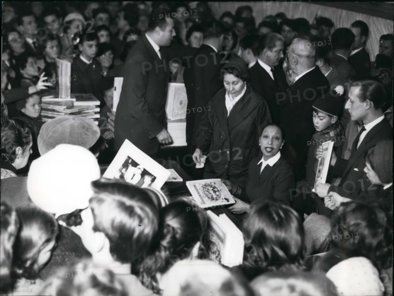 Dec. 12, 1957 - Josephine Baker in Frankfurt: Well known star Josephine Baker arrived at Frankfurt to sell her Book ''Children of the Rainbow'' in one of the big stores at Frankfurt. People went crazy for buying Books with Josephines own Autogram.