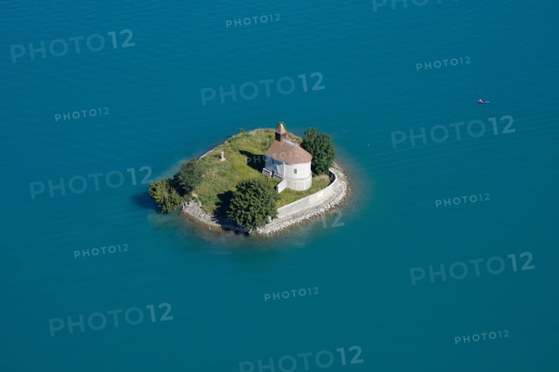 CHAPEL ON AN ISLAND SURROUNDED BY TURQUOISE WATERS (aerial view). Saint-Michel island, Chorges, Lake Serre-Ponçon, Hautes-Alpes, France.