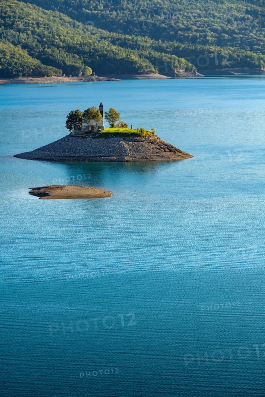 The Saint Michel Chapel and Serre Poncon lake. Saint Michel Bay, Hautes Alpes, Southern French Alps, France