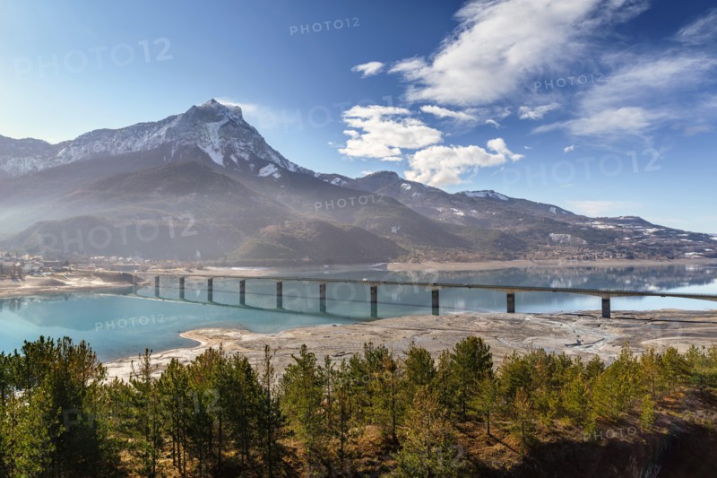 Pont de Savines with Serre-Poncon lake and the Grand Morgon on an early winter morning. Savines-le-Lac, Hautes-Alpes, Southern French Alps. France