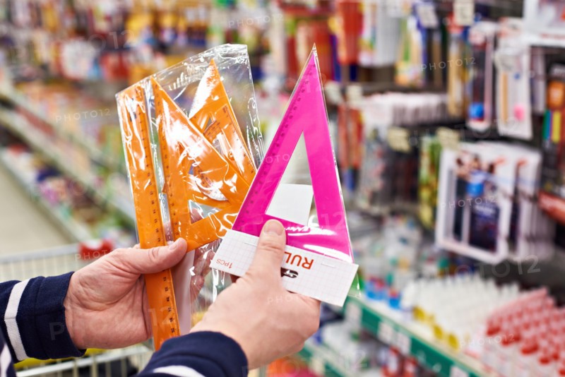 Buyer selects plastic rulers and angles in the stationery store