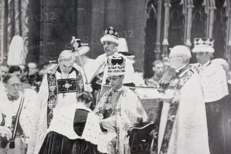 King George VI receives the homage of princes and peers following his coronation in 1937.
