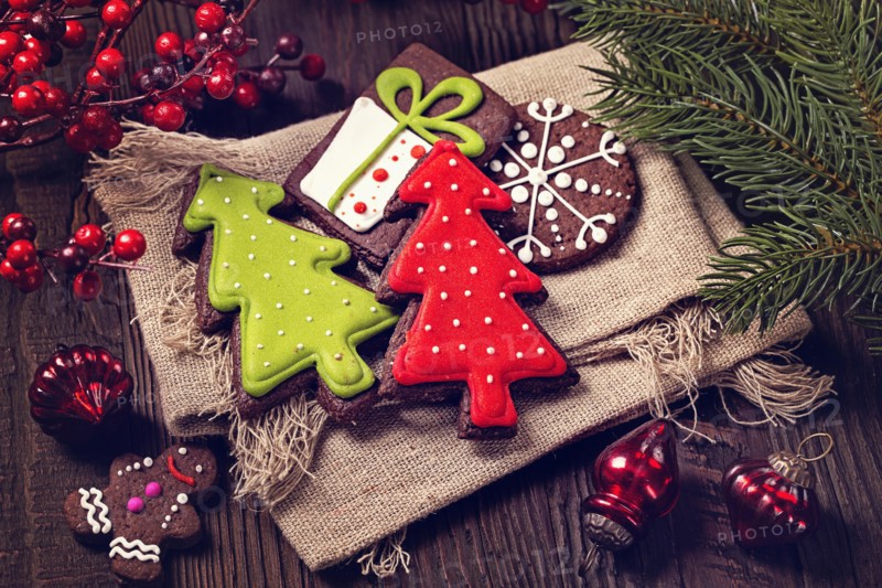 Chocolate christmas cookies on a wooden brown background