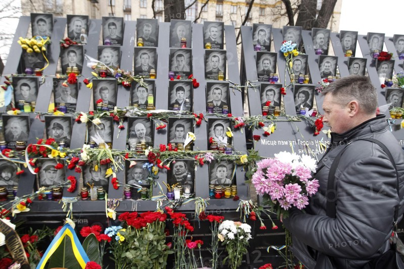 Kiev, Ukraine. 20th Feb, 2020. A man lays flowers to memorial in memory of the Heavenly Hundred, activists who were killed during anti-government protests of 2014, in Kiev, Ukraine, on 20 February 2020. Ukrainians mark the 6th anniversary of the Maidan revolution or Revolution of Dignity. Credit: Serg Glovny/ZUMA Wire/Alamy Live News