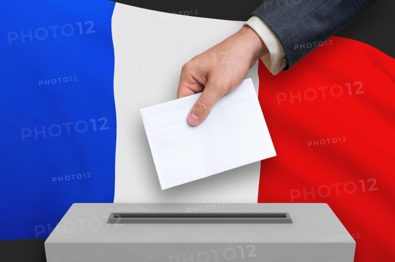 Election in France - voting at the ballot box. The hand of man is putting his vote in the ballot box. 3D rendered illustration.