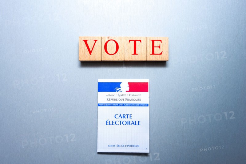 French voting card or carte electorale with wooden blocks and the word vote on them