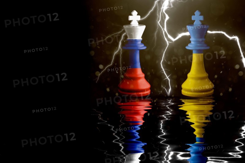 Ukraine and Russia flags paint over on chess king. 3D illustration Ukraine vs Russia crisis.