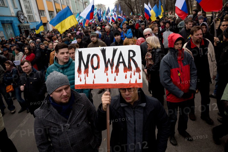 Moscow, Russia. 15th March, 2014 People hold anti-war banners during the Peace March by the Boulevard ring of central Moscow in support of the Ukrainian people and against military action