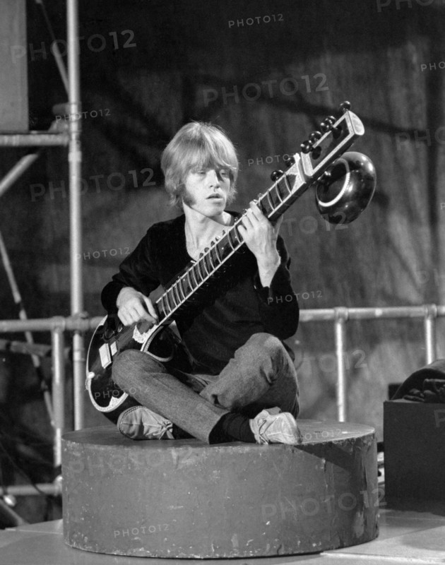 ROLLING STONES  - Brian Jones playing sitar on Paint It Black in May 1966. Photo Tony Gale