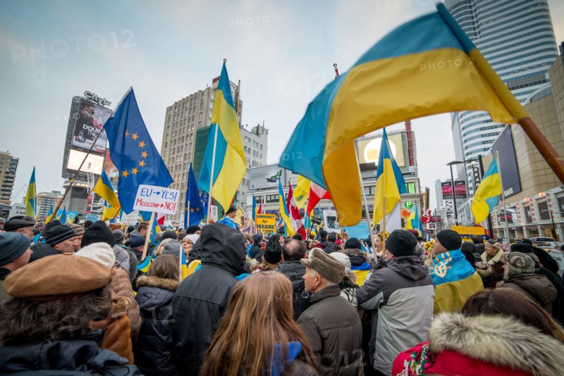 TORONTO - DECEMBER 15: Hundreds gather to protest for Ukraine on December 15, 2013 at Yonge - Dundas Square in Toronto, Canada.