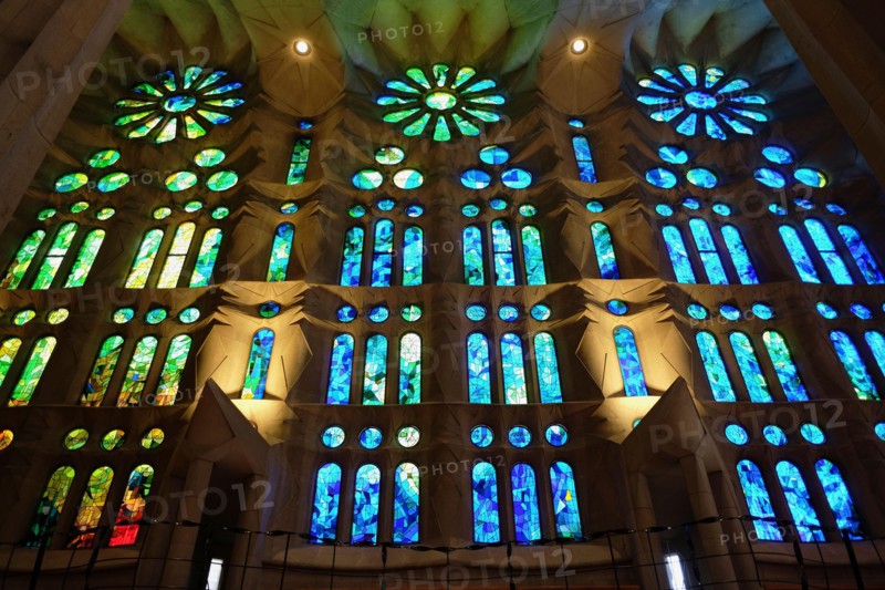Spain, Catalonia, Barcelona, Interior of the Sagrada Familia designed by Antoni Gaudi, Nave, Passion side, Joan Vila-Grau designed stained glass .
