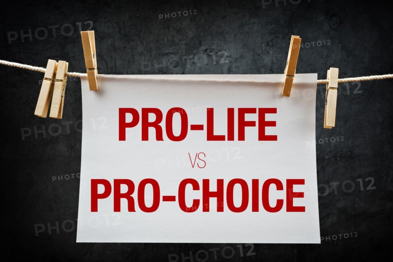 Pro-life vs pro-choice, female right on abortion concept